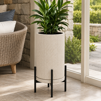 Cream ribbed ceramic indoor planter with green plant in modern home interior - image 3