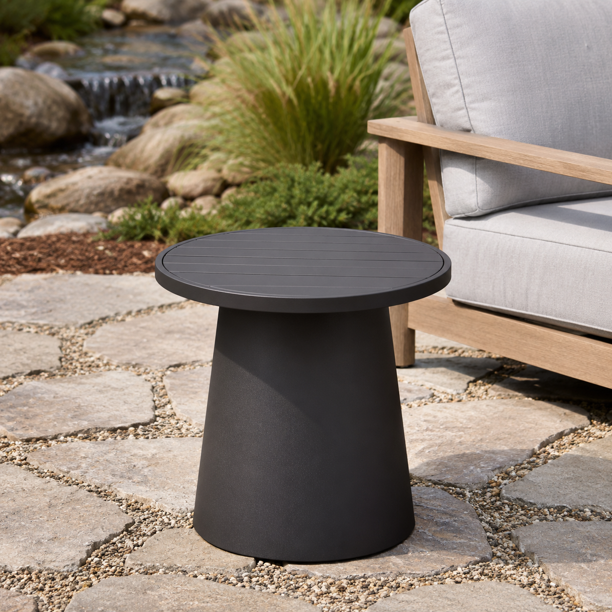 Modern outdoor patio side table beside lounge chair in garden terrace setting - image 3