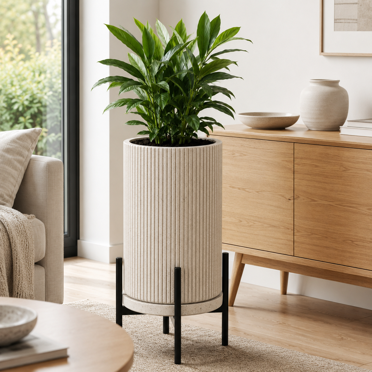 Tall ribbed planter with black metal stand and green plant in modern home - image 2